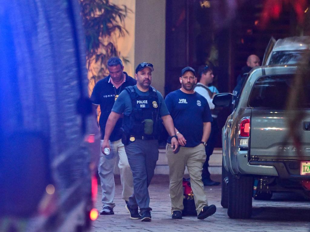 Homeland Security Investigation agents are seen at the entrance of Combs' home at Star Island in Miami Beach. Picture: Giorgio Viera/AFP