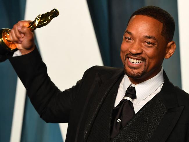 US actor Will Smith holds his award for Best Actor in a Leading Role for "King Richard" as he attends the 2022 Vanity Fair Oscar Party following the 94th Oscars at the The Wallis Annenberg Center for the Performing Arts in Beverly Hills, California on March 27, 2022. (Photo by Patrick T. FALLON / AFP)