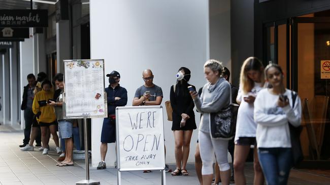 A queue outside Woolworths in Mascot, Friday 3 April 2020. Picture: Nikki Short