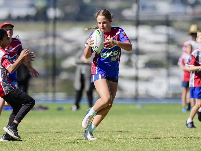 Macey McKellar keeps possession for Highfields State School in the inaugural Primary Interschools Reconciliation Touch Carnival hosted by Glenvale State School, Wednesday, May 28, 2025. Picture: Kevin Farmer