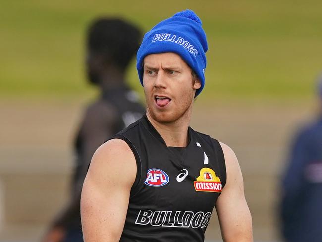 Lachie Hunter of the Bulldogs runs with the ball during an AFL Western Bulldogs training session at VU Whitten Oval in Melbourne, Wednesday, June 17, 2020. (AAP Image/Scott Barbour) NO ARCHIVING