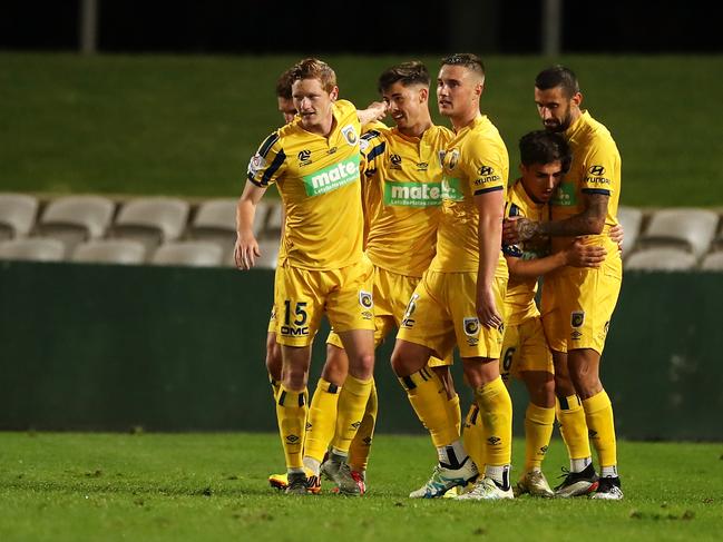 .Mariners players celebrate their 3-2 win over Melbourne Victory. Picture: Mark Kolbe/Getty Images