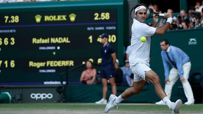 Roger Federer returns against Rafael Nadal. Picture: AFP