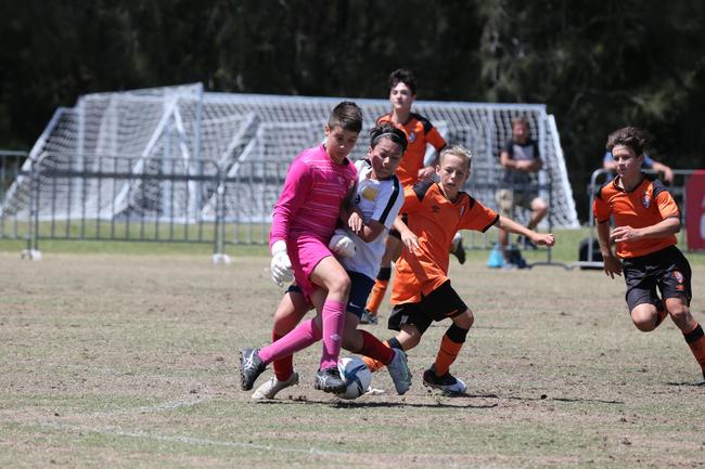 The Premier Invitational football tournament on the Gold Coast. Brisbane Roar Orange v TFC Brisbane White under-13s in action. Picture: Mike Batterham.