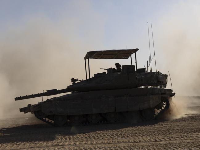 SOUTHERN ISRAEL, ISRAEL - APRIL 17: An Israeli tank moves a long the border after leaving the Gaza Strip on April 17, 2024 in Southern Israel. Israel's allies, including the UK and US, have urged the country to avoid escalation of conflict with Iran after it launched hundreds of missiles and drones at Israel over the weekend. Meanwhile, foreign mediators in the conflict continue to push for a ceasefire in the war in Gaza and an increase in distribution of humanitarian aid there.(Photo by Amir Levy/Getty Images)