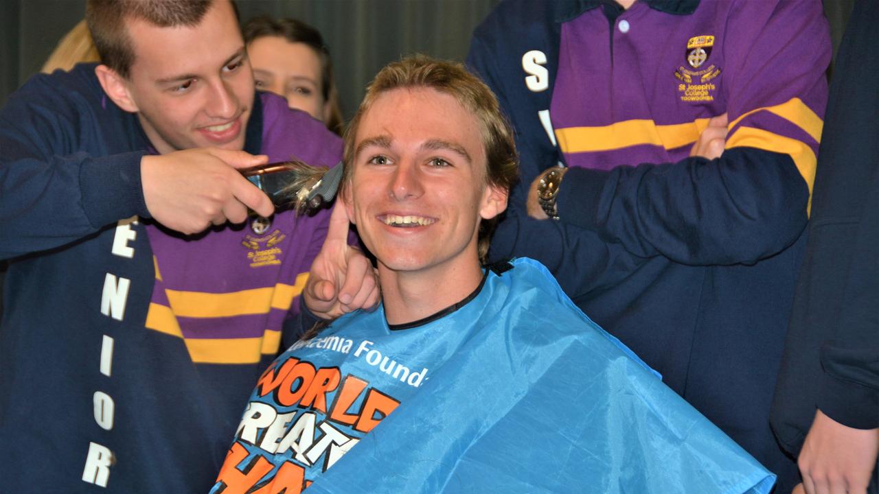 At the St Joseph's College 2023 World's Greatest Shave event is student Charlie Kruger having his hair cut by friends. Picture: Rhylea Millar