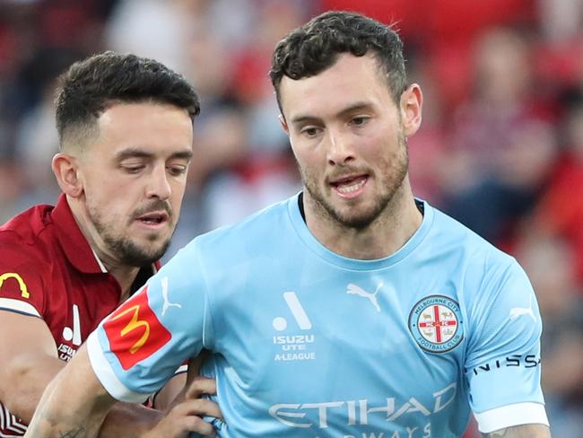 ADELAIDE, AUSTRALIA - MARCH 03: Aiden O'Neill of Melbourne City and  Zach Clough of Adelaide United during the round 19 A-League Men's match between Adelaide United and Melbourne City at Coopers Stadium, on March 03, 2023, in Adelaide, Australia. (Photo by Sarah Reed/Getty Images)