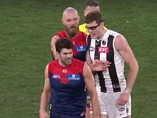 Christian Petrecca and Mason Cox clash after the siren on King's Birthday at the MCG