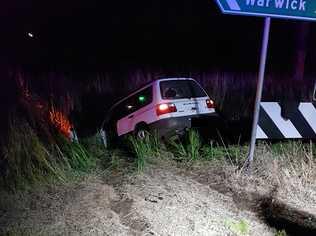 STUCK: A single-vehicle crash on Gatton-Clifton Rd last night ripped a sign from the ground. Picture: Contributed