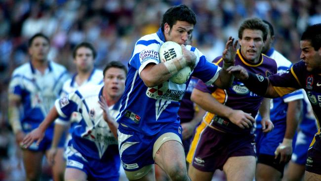 Who’s that guy? Yep. It’s Dennis Scott on the charge during Brisbane v Canterbury Bulldogs NRL game at Suncorp Stadium in 2004. Picture Patrick Hamilton.