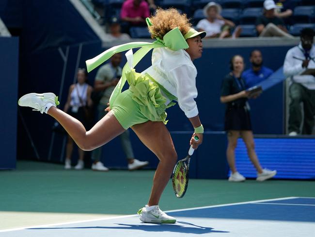 Japan's Naomi Osaka warms up before her women's singles first round match against Latvia's Jelena Ostapenko on day two of the US Open tennis tournament at the USTA Billie Jean King National Tennis Center in New York City, on August 27, 2024. (Photo by TIMOTHY A. CLARY / AFP)