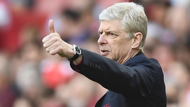 Arsene Wenger gestures from the touchline.