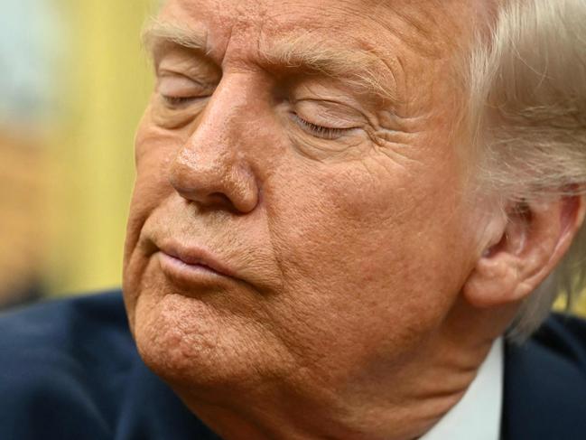 TOPSHOT - US President Donald Trump speaks after signing executive orders in the Oval Office of the White House in Washington, DC on March 6, 2025. (Photo by Mandel NGAN / AFP)