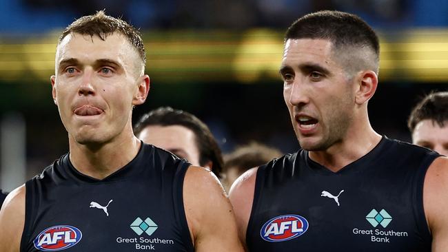 MELBOURNE, AUSTRALIA - MARCH 13: Patrick Cripps (left) and Jacob Weitering of the Blues look dejected after a loss during the 2025 AFL Round 01 match between the Richmond Tigers and the Carlton Blues at the Melbourne Cricket Ground on March 13, 2025 in Melbourne, Australia. (Photo by Michael Willson/AFL Photos via Getty Images)