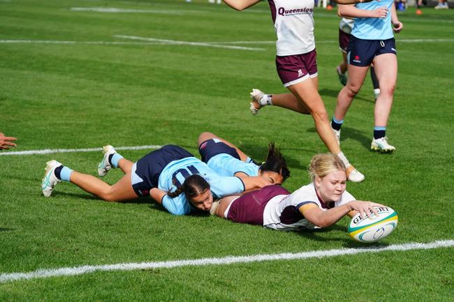 QLD White under 16s captain Poppy Gibbons reaches out to score at the 2024 Australian Schools Rugby Championships. Picture: Anthony Edgar.