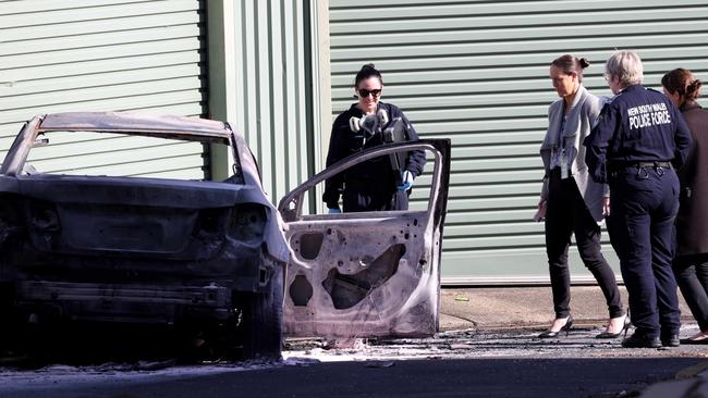 Police examine the destroyed car found in Zetland following Alen Moradian’s murder. Picture: NCA NewsWire