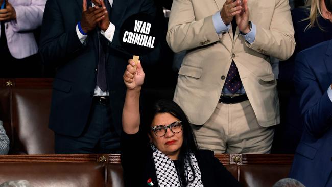 Inside the chamber, Ms Tlaib holding her sign calling the Israeli Prime Minister a “war criminal”. Picture: Anna Moneymaker/Getty Images via AFP