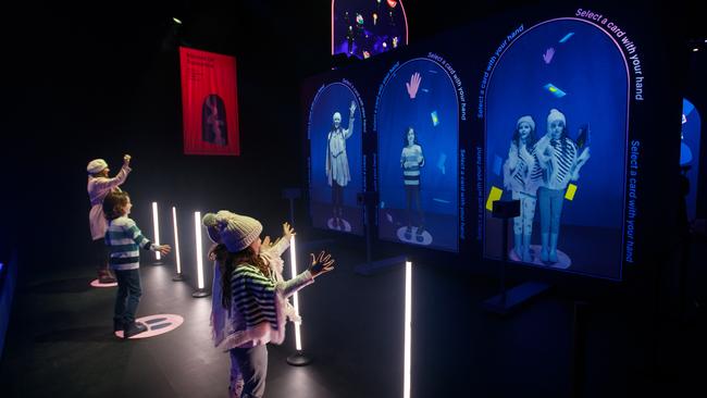 Twins Scarlett and Sienna with brother Max and mum Irene at Mirror Mirror, part of Illuminate Adelaide in Victoria Square. Picture Matt Turner.