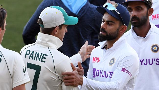 India's captain Virat Kohli congratulates Aussie skipper Tim Paine after Australia's first Test victory. Picture: AFP