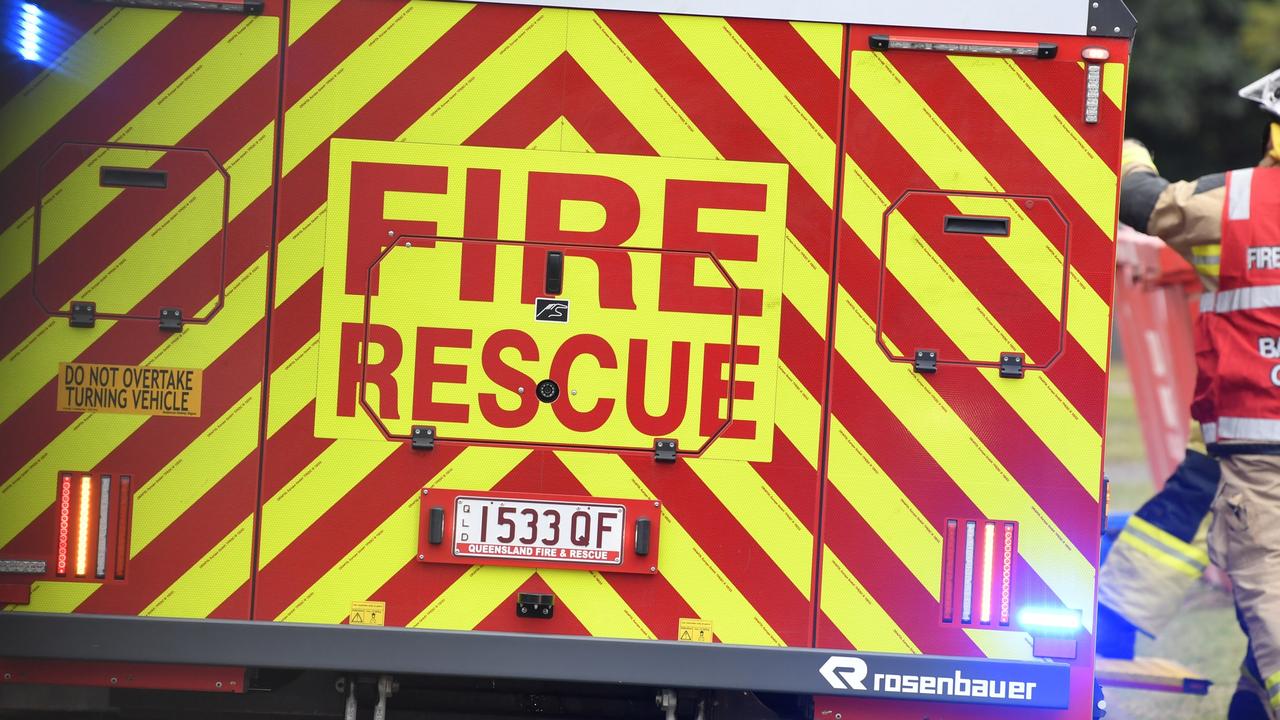 Suburban street closed as fire threatens home