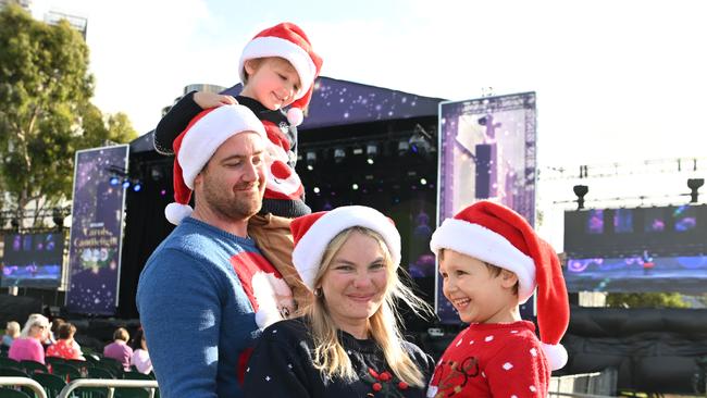 Michael and Taiten, 3, Amelia and Leo Faturik, 6, from Seaford Meadows at the Sealink Carols By Candlelight in Elder Park, Tarntanya, Kaurna Yarta, Adelaide on Sunday, December 11, 2022. (The Advertiser/ Morgan Sette)