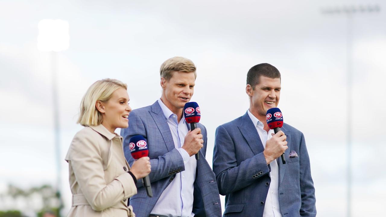 Television commentators Sarah Jones, Nick Riewoldt and Jonathan Brown are seen during the AFL Marsh Community Series.