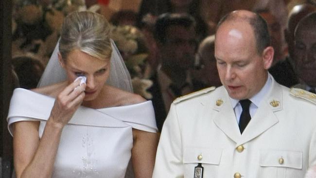 Princess Charlene wipes a tear as Prince Albert II of Monaco looks on during their wedding ceremony in the Main Courtyard of the Prince's Palace in Monaco. Picture: AP