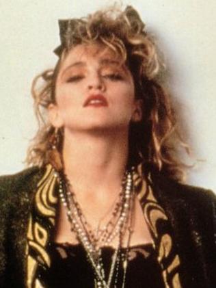 Desperately Seeking Susan (1985) Bras in public, layered crucifix  necklaces, lace gloves. Madonna set a trend that wom…