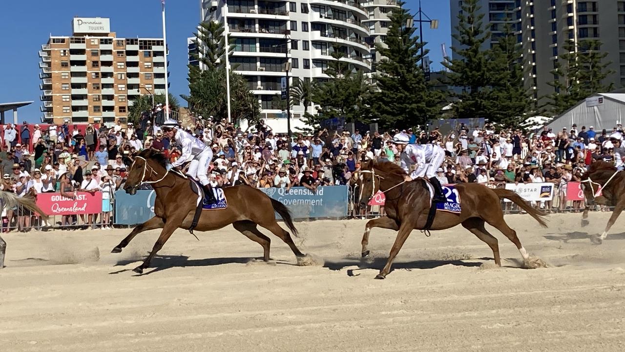 Hundreds flock to iconic Magic Millions beach gallop