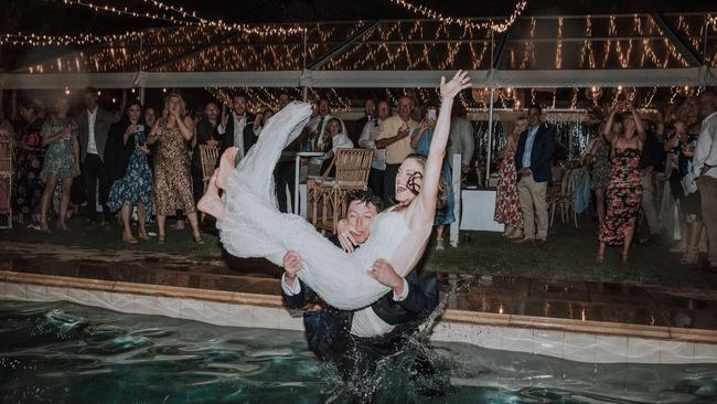 Ella and Ryan Muggleton finish their night by jumping in the pool. Photographer: Evan Bailey