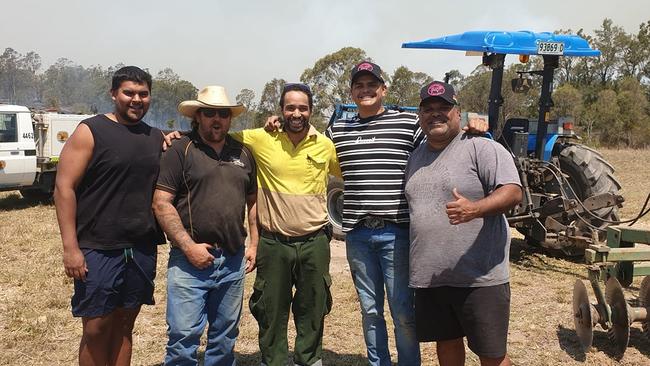 Latrell Mitchell helping out during the bushfire crisis late last year.