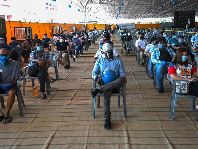 People wait to get the COVID-19 vaccine in a hospital in New Delhi. Picture: AFP