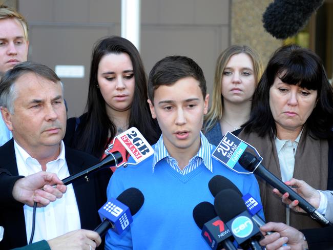 Family and friends of Thomas Kelly, including his father Ralph (front left) and brother Stuart (centre) and mother Kathy (2nd from right) speak to the media as they leave court after the sentence appeal hearing for their son's killer Kieran Loveridge in 2014. Picture: Dean Lewins/AAP