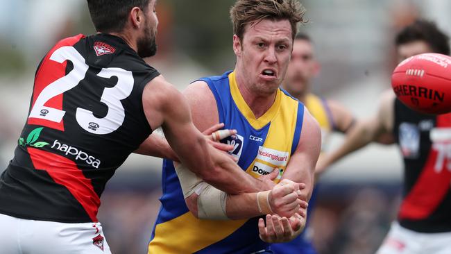 Williamstown’s Nick Meese gets away a handball against Essendon in this year’s finals.