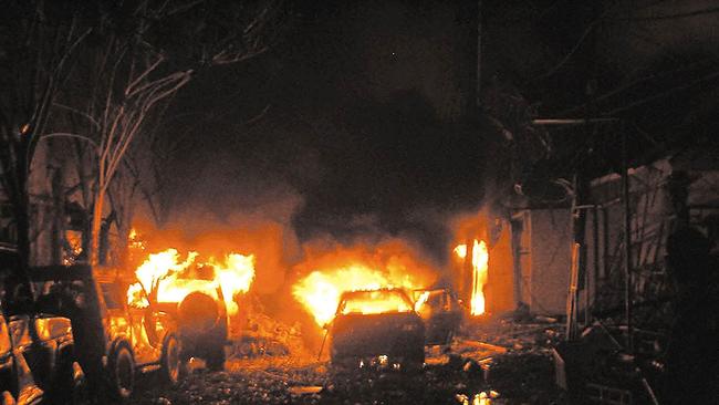 Buildings and cars on fire in Kuta, Bali on October 13, 2002. Picture: AFP