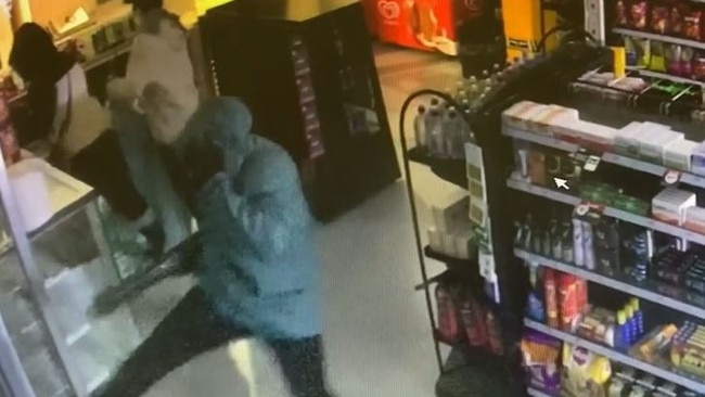 A youth was seen attempting to kick-in a door to gain access to a different part of the store. Picture: Victoria Police