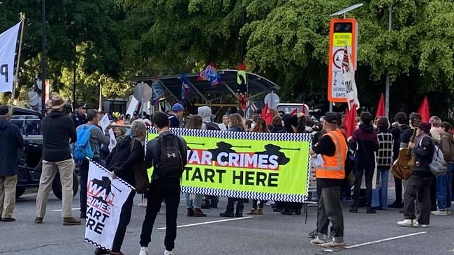 Protesters outside the Brisbane Convention and Exhibition Centre where the Land Forces Expo.