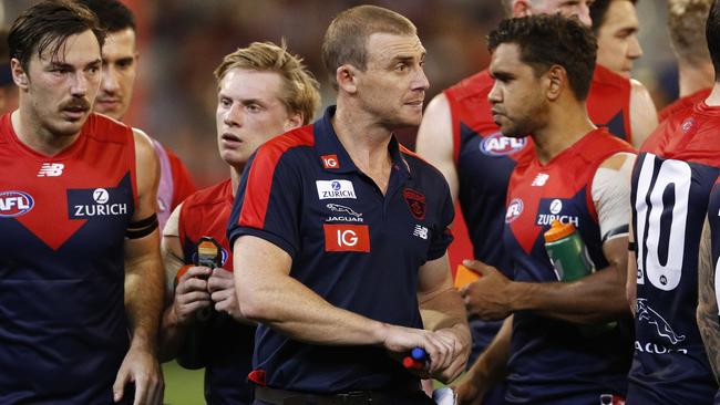 Demons head coach Simon Goodwin (centre) is seen during the Round 5 AFL match between the Melbourne Demons and the St Kilda Saints at the MGC in Melbourne, Saturday, April 20, 2019.  (AAP Image/Daniel Pockett) NO ARCHIVING, EDITORIAL USE ONLY