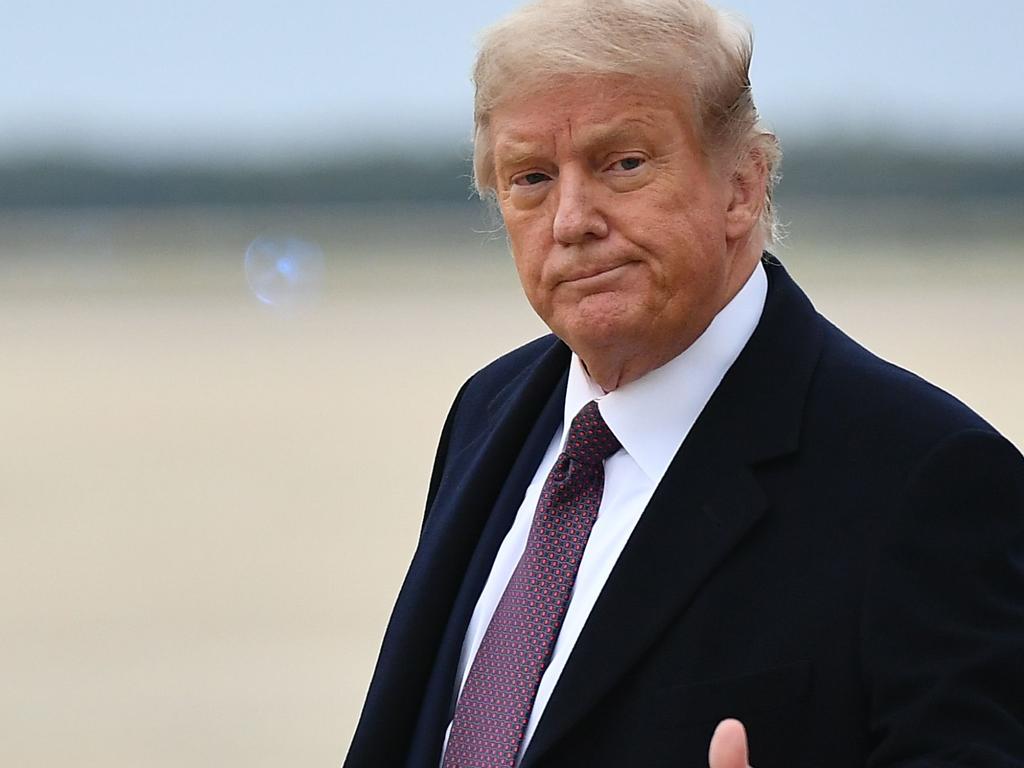 US President Donald Trump steps off Air Force One on Thursday after attending a fundraiser. just a day before his positive result. Picture: MANDEL NGAN / AFP