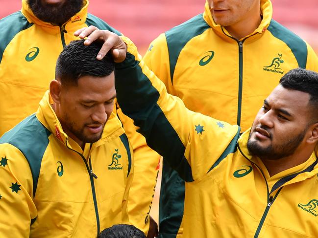 Wallabies player Israel Folau (left) and Taniela Tupou (right) are seen during the team photograph before the team captains run at Suncorp Stadium in Brisbane, Friday, September 7, 2018. The Australian Wallabies are facing the South African Springboks on Saturday night at Suncorp Stadium in Brisbane. (AAP Image/Darren England) NO ARCHIVING