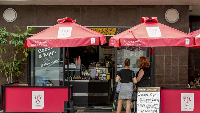 Umbrellas still stand outside the cafe but chairs and tables are packed up with the eatery now offering only takeaway and delivery. Picture: Jerad Williams