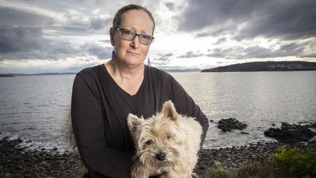 Susan Molnar with her dog Hamish at Primrose Sands. Picture: Chris Kidd