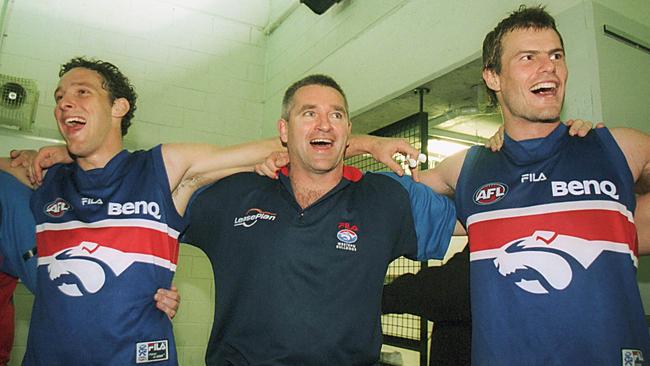 Mitch Hahn, Peter Rohde and Luke Darcy celebrate a Bulldogs win in 2002.