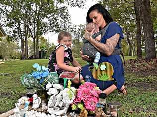 MUM'S HEARTACHE: Deanne Gillbee, pictured with daughter Ciarah, 9 and son Ryder, five months, is pleading for increased security at the Caloundra Cemetery after her son's grave was targeted by thieves for the second time. Picture: Warren Lynam