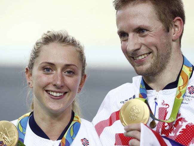 Winners are grinners: Laura Trott and Jason Kenny with their golds. Picture: AFP/Odd Andersen.