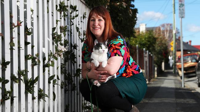 Bec Secombe of Sandy Bay with her cat Theo who likes walking on a lead around the streets. Picture: NIKKI DAVIS-JONES