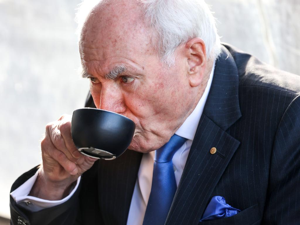 Former Prime Minister John Howard enjoys a cappuccino. Picture: Ian Currie