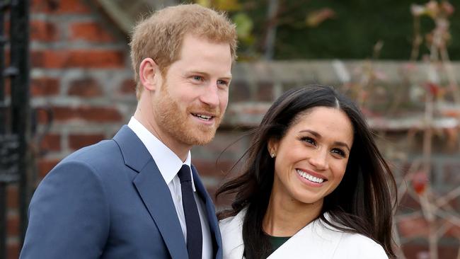 Prince Harry and actress Meghan Markle during an official photocall to announce their engagement at The Sunken Gardens at Kensington Palace this morning.