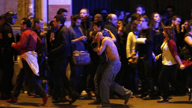 Wounded people are evacuated outside the scene of a hostage situation at the Bataclan theatre in Paris. P<i>icture: EPA/YOAN VALAT</i>