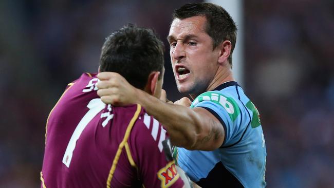 BRISBANE, AUSTRALIA - JUNE 26: Mitchell Pearce of the Blues and Billy Slater of the Maroons grapple during game two of the ARL State of Origin series between the Queensland Maroons and the New South Wales Blues at Suncorp Stadium on June 26, 2013 in Brisbane, Australia. (Photo by Chris Hyde/Getty Images)